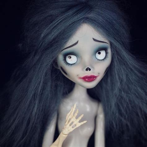 A Creepy Doll With Long Black Hair And Blue Eyes