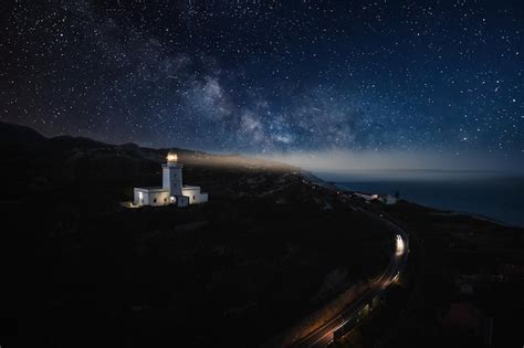 Premium Photo | Lighthouse by night aerial view