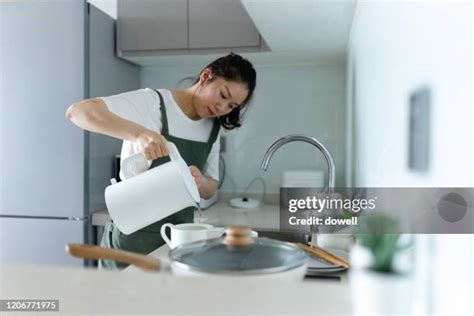 241 Woman Pouring Boiling Water Stock Photos High Res Pictures And