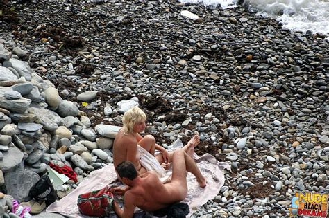 Naked Milf Playing With Her Man On The Beach Photos