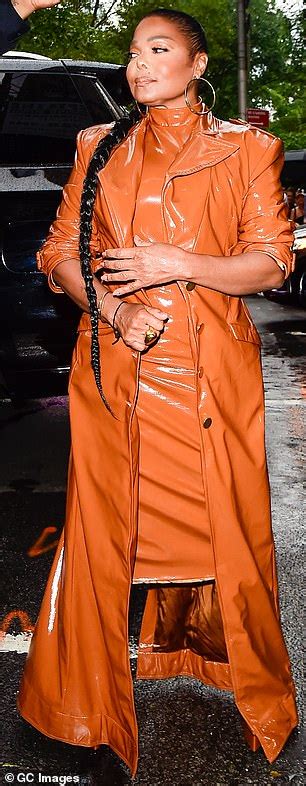 Janet Jackson Rocks Brown Leather Dress And Matching Jacket As She