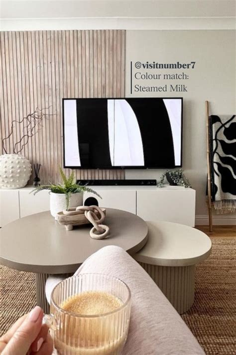 A Beautifully Presented Living Room Featuring Wood Panelled Walls And