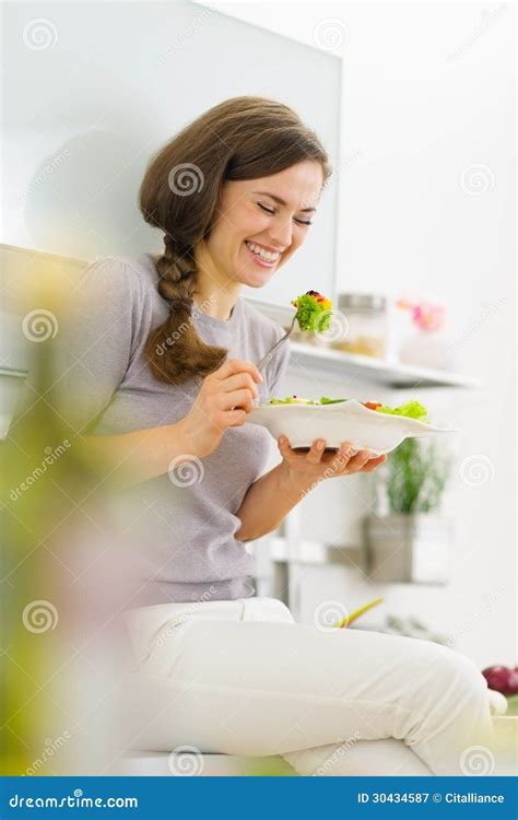 Happy Woman Eating Fresh Salad In Kitchen Stock Image Image Of