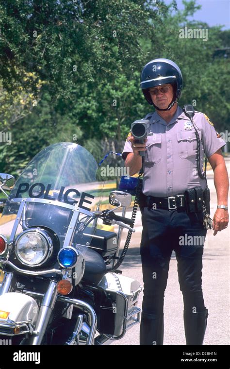 Police Officer Checking Speed With Radar Gun Stock Photo - Alamy