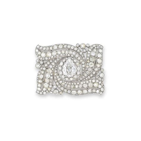 A DIAMOND BROOCH, BY CARTIER | Christie's