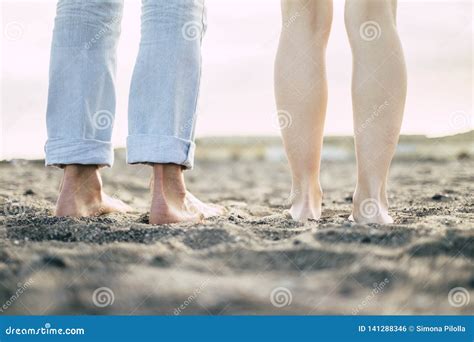 Ground And Rear View Of Feet From Man And Woman Couple In Friendship Or Relationship Naked
