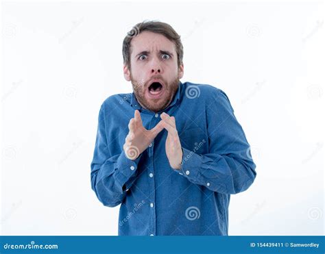 Close Up Portrait Of Concern Shocked Young Man With Frightened Gestures