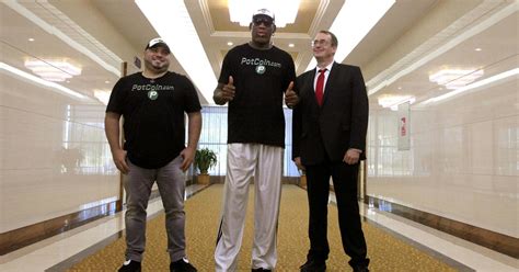 Dennis Rodman flies into North Korea again - CBS News