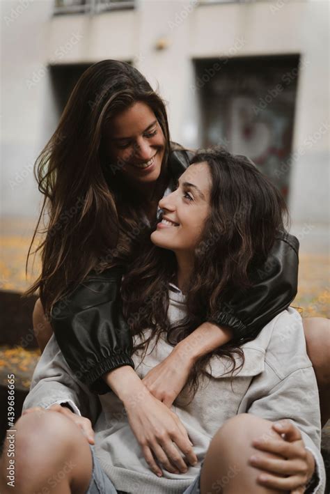 Lesbian Couple Hugging And Laughing Stock Photo Adobe Stock