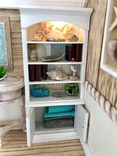 An Open Shelf In The Corner Of A Room With Towels And Other Items On It