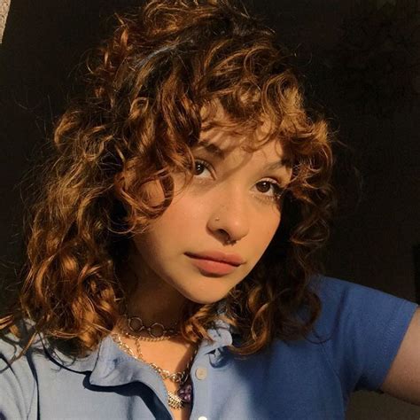 Close Up Of A Person With Curly Hair