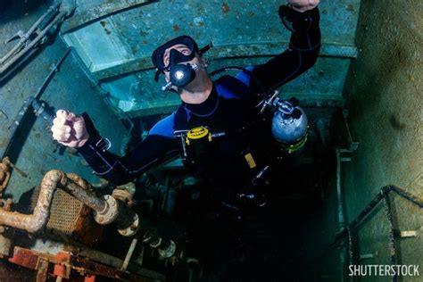 History Of Grand Cayman's Kittiwake Shipwreck | Scuba Diving