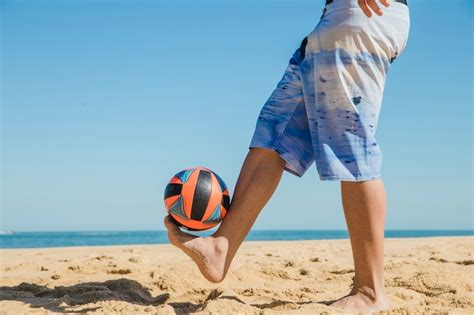 Free Photo | Playing with the ball on the beach