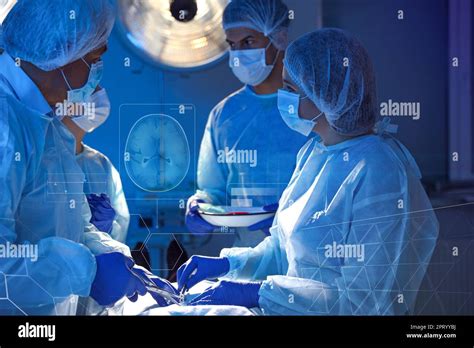 Team Of Professional Doctors Performing Operation In Surgery Room And