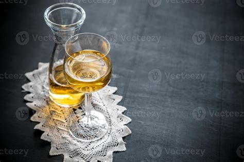 Glass of white wine in vintage decor 13695621 Stock Photo at Vecteezy