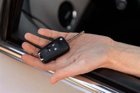 Free Photo High Angle Hand Holding Car Key