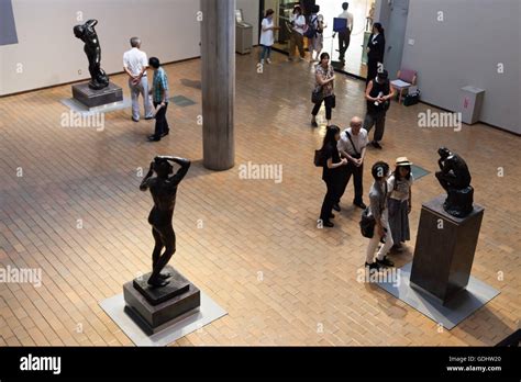 Visitors Look At Sculptures At The National Museum Of Western Art In