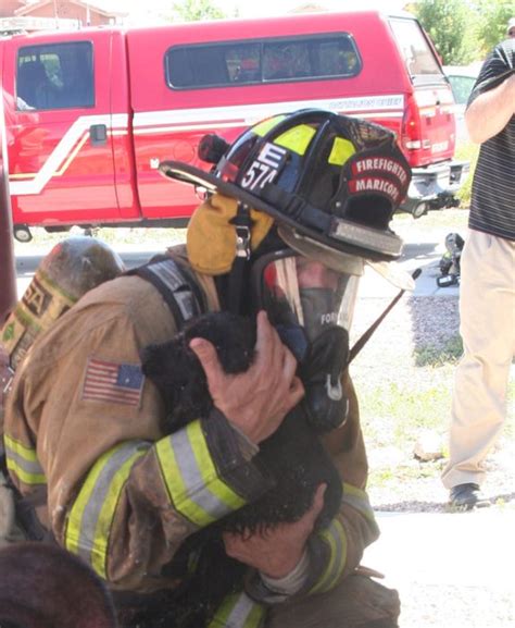 23 Heartwarming Photos of Firefighters Rescuing Animals