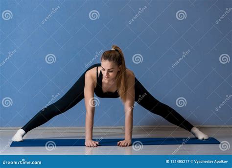 Blonde Girl Stretching Her Legs Widely Stock Image Image Of Activity Indoor