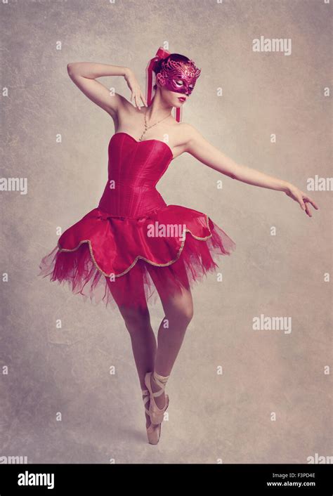 A Graceful Ballerina Dancing On Point Wearing A Red Tutu And A Red