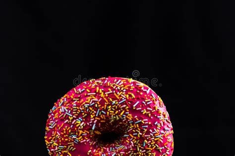 Pink Glazed Donut With Sprinkles Isolated Close Up Of Colorful Donut