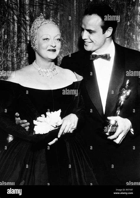 The 27th Academy Awards / 1955. Bette Davis with Marlon Brando, winner of the best actor award ...