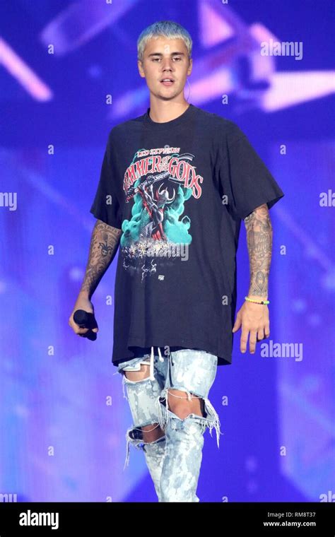 Singer Justin Bieber Is Shown Performing On Stage During A Live