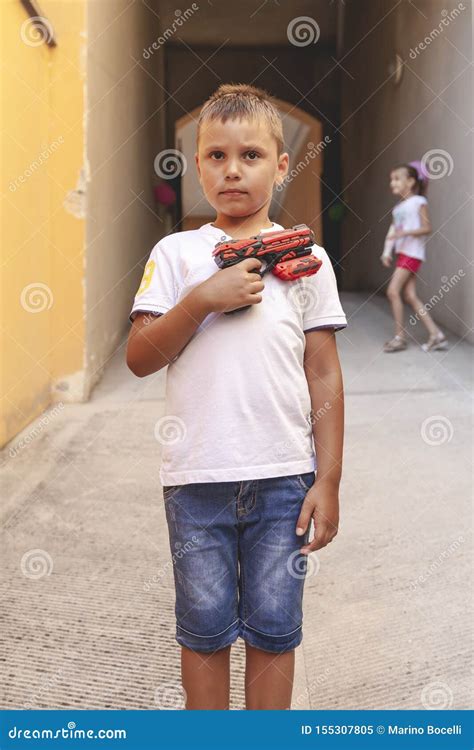 Portrait of Little Boy with a Water Gun Stock Image - Image of leisure, joyful: 155307805