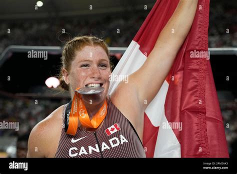 Sarah Mitton, of Canada, poses after after winning the silver medal in ...