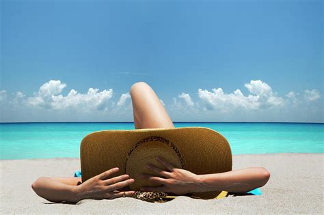 Woman Laying On Towel On Beach by Lost Horizon Images