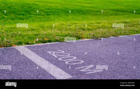 Jogging Track In The Park At Summer Day 2000 Meters Distance Sign