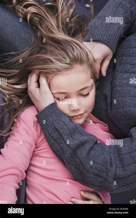 Young Blonde Girl Lying In Her Mothers Lap Hartford Connecticut Usa