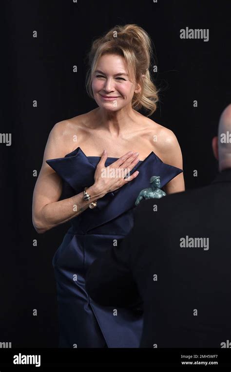 Renee Zellweger Poses In The Press Room With The Award For Outstanding