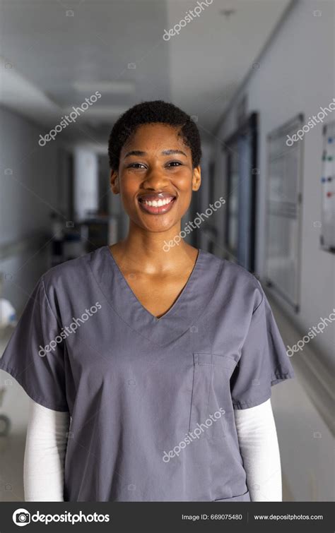 Portrait Happy African American Female Doctor Wearing Scrubs Corridor ...