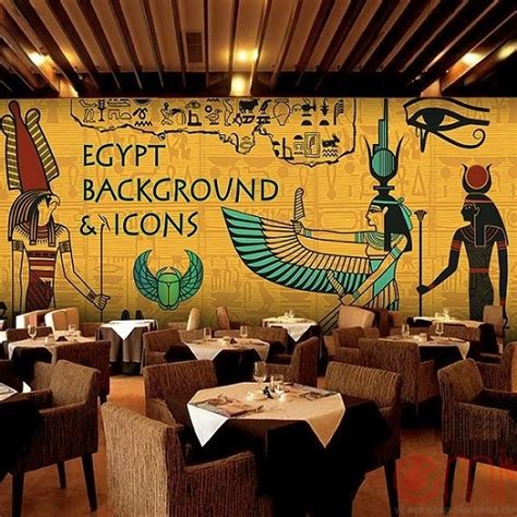 An Egyptian Themed Restaurant With Tables And Chairs In Front Of A Wall