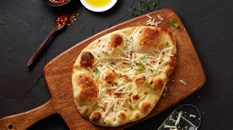 Warm Naan Topped With Olive Oil And Cheese Stonefire Authentic Flatbreads