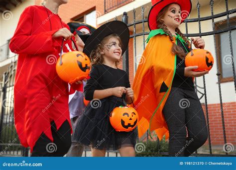 Cute Little Kids Wearing Halloween Costumes Going Trick-or-treating ...