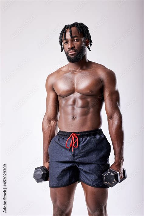 Attractive Muscular African Man Working Out With Dumbbells Photo Of