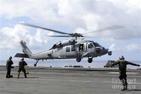 An Mh S Sea Hawk Lands On The Flight Photograph By Stocktrek Images