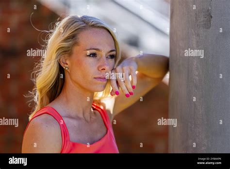 Radiant Blonde Athlete Shines At The Track On A Stunning Day Embodying Strength And Grace In