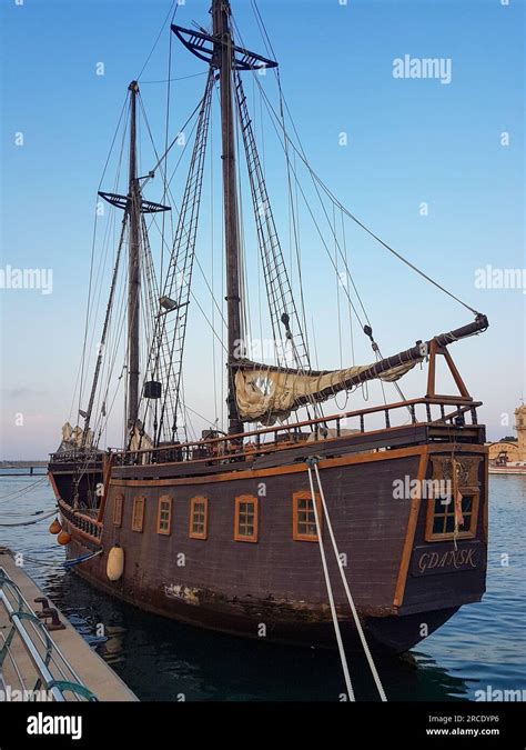 Small Old Wooden Pirate Ship With Old Mast And Sails In Gandia Harbor