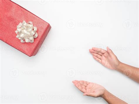 Hand Giving Gift Box On White Background Copy Space Top View 16686646