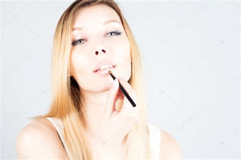 Sexy Blonde Woman Applying Lipstick On Lips Make Up Artist Stock Photo By FlashRomance