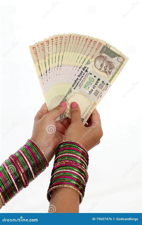 Traditional Indian Woman Holding Five Hundred Rupee Notes Stock Photo