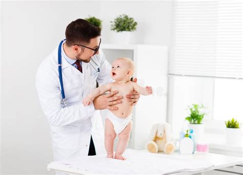 Doctor Pediatrician with Baby Child Stock Image - Image of face, cute: 76707175