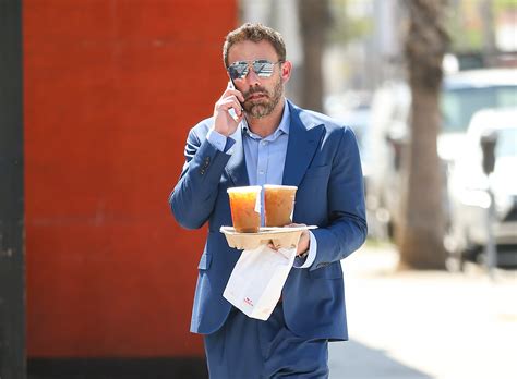 Ben Affleck serves drive-thru customer J.Lo as he films Dunkin