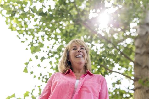 Mature Woman Outside Wearing In Pink Clothes Stock Image Image Of Flowers People