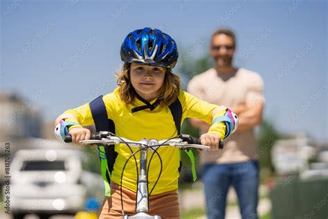 Father And Son On The Bicycle Father And Son Riding A Bike In Summer