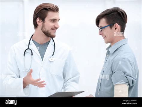 doctor gives advice to his patient Stock Photo - Alamy
