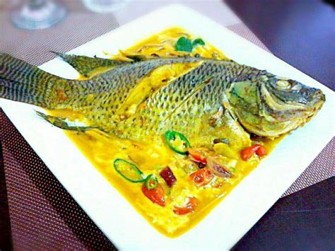 Curried And Soured Whole Fish Tilapia In Creamy Coconut Milk Coconut